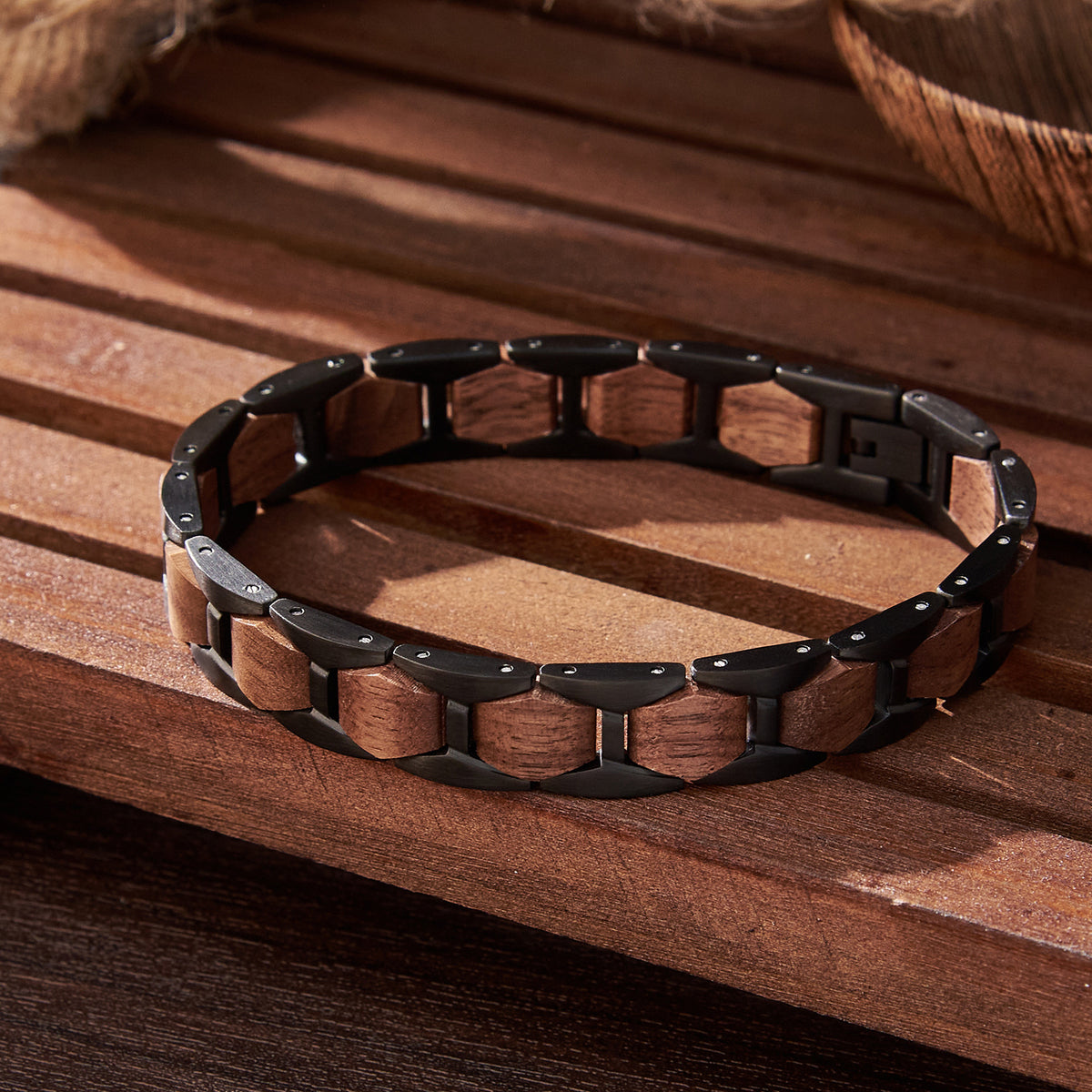 Men's bracelet made of black stainless steel and walnut wood, featuring a rugged design, perfect for men's fashion and accessories.