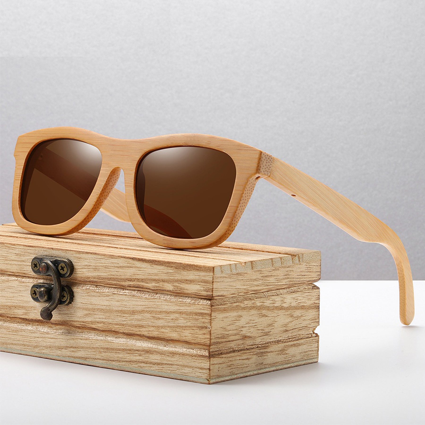 Brown polarized lens bamboo eyewear standing on a wooden box