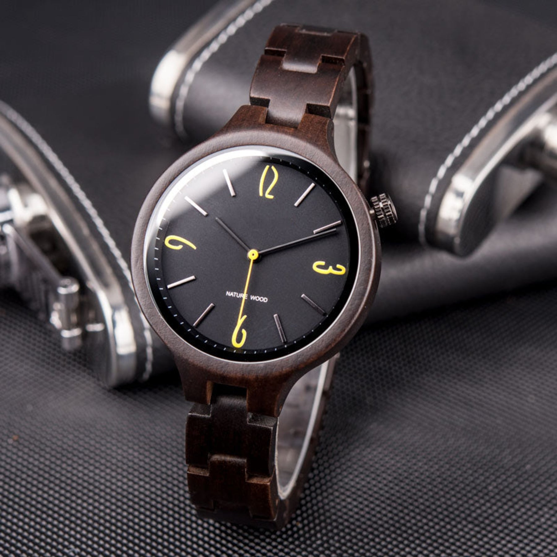 The black face ebony women wooden watch standing on the table