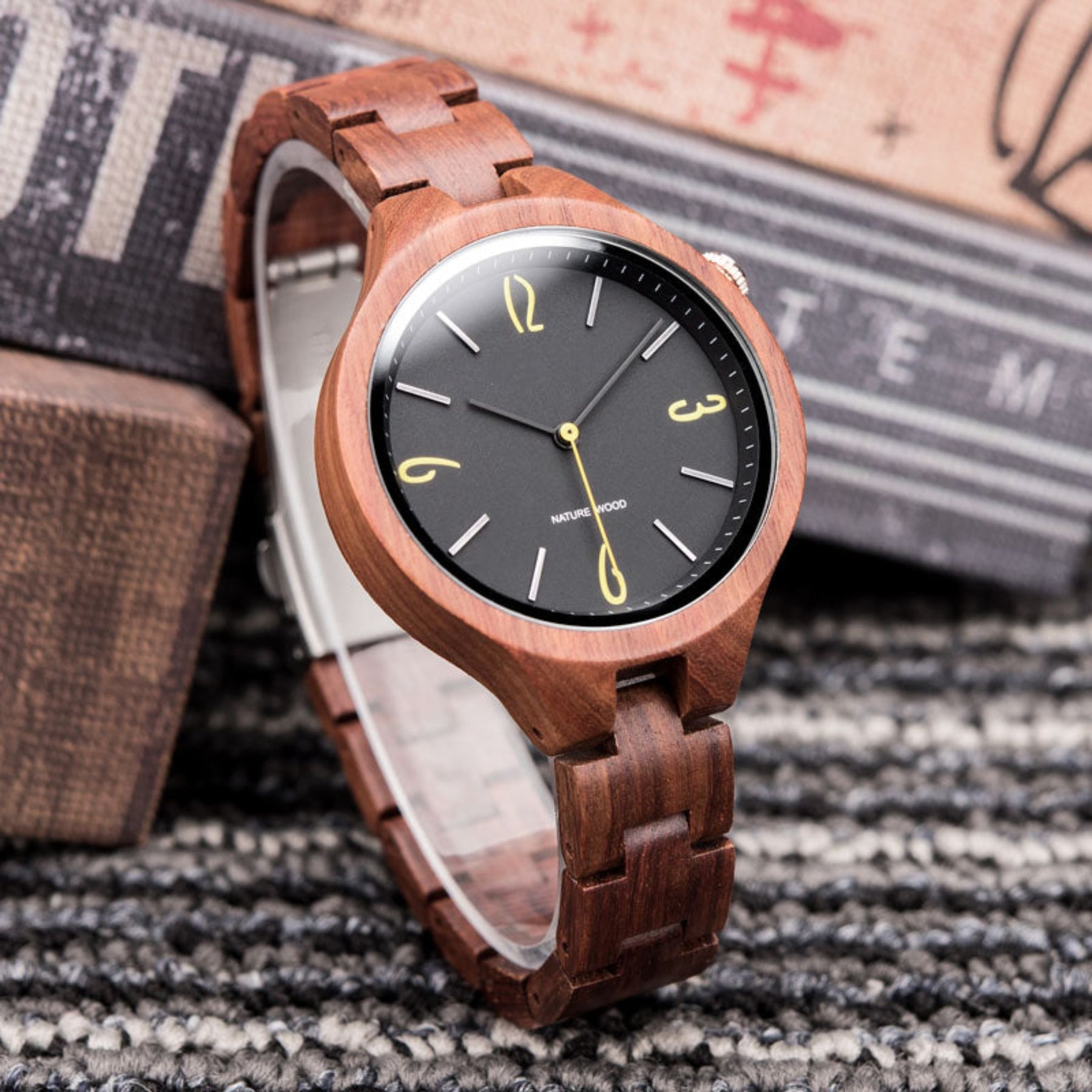 Black face red sandalwood women wooden watch standing on table