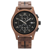 A men's chronograph watch featuring a brown wooden case and band, a black dial with silver-tone numerals, hands, sub-dials, and a date display, isolated on a white background.