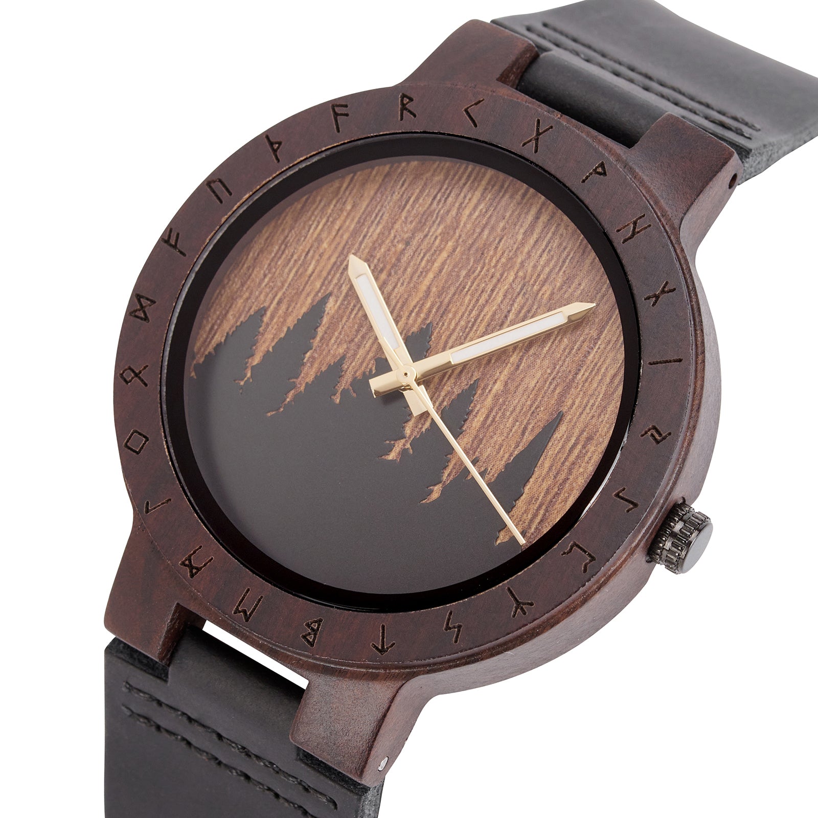 A close-up of a unique dark wooden watch with a runic symbol bezel, forest silhouette dial, black leather band, and gold-tone hands, emphasizing the natural wood texture against a white background.