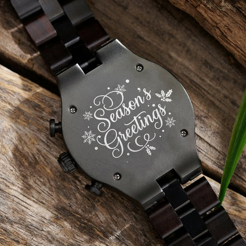 A detailed view of the back case of a men's dark wooden chronograph watch with green accents, displayed on a wooden surface to emphasize its craftsmanship and rugged design.