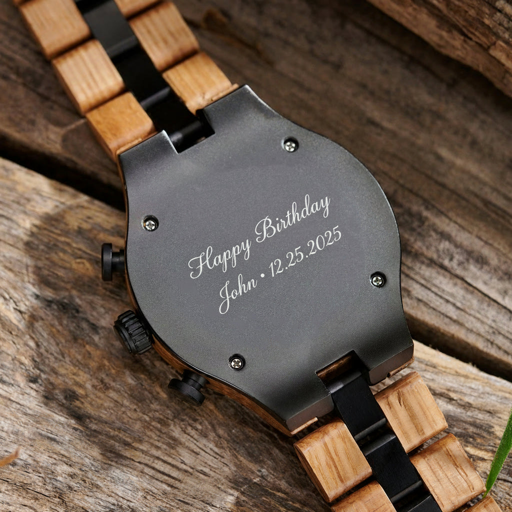 A detailed view of the back case of a men's wooden chronograph watch with gold and black accents, displayed on a wooden surface to emphasize its craftsmanship and rugged design.