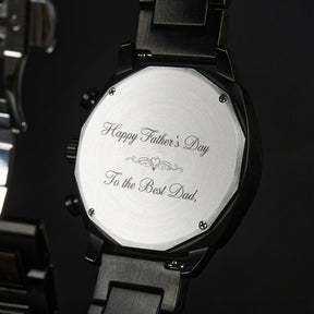 A detailed view of the back case of a men's wooden chronograph watch, showcasing its metallic finish and structural design elements.