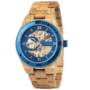 A men's automatic mechanical watch crafted from oak wood and blue stainless steel, featuring a skeleton dial that displays intricate golden mechanical movements, marked with Roman numerals and a blue bezel, set against a plain white background.