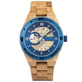 A men's automatic mechanical watch made of oak wood and blue stainless steel, featuring a skeleton dial that reveals intricate golden watch mechanisms, with Roman numerals and a blue bezel, presented against a plain white background.
