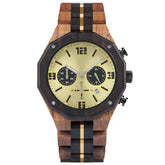 A men's chronograph watch featuring a combination of multicolored wood and gold-accented bands, a gold dial with bold numerals, multiple sub-dials, date display, and metallic pushers, isolated on a white background.