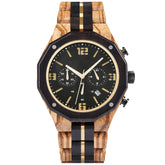 A men's chronograph watch featuring a combination of multicolored wood and gold-accented bands, a black dial with gold numerals and markers, multiple sub-dials, date display, and metallic pushers, isolated on a white background.