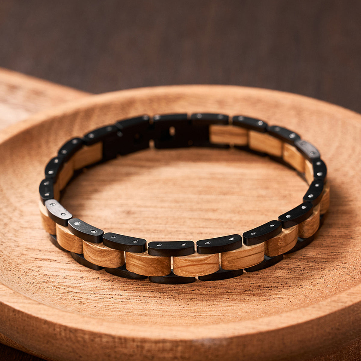 Men's bracelet crafted from oak wood and black stainless steel, a sleek and unique accessory for fashionable men.