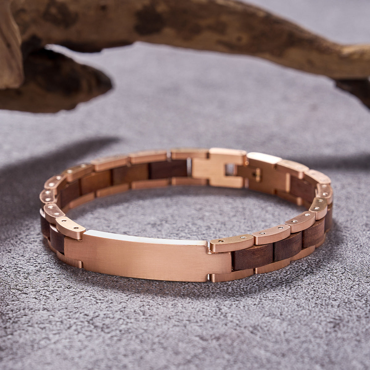 Men's elegant bracelet crafted with rose gold stainless steel and natural walnut wood links, showcasing a sleek design ideal for men's fashion accessories.