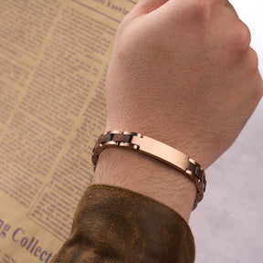Men wearing a sophisticated bracelet with rose gold stainless steel and natural walnut wood links, paired with a brown sleeve, ideal for men's fashion and everyday accessorizing.