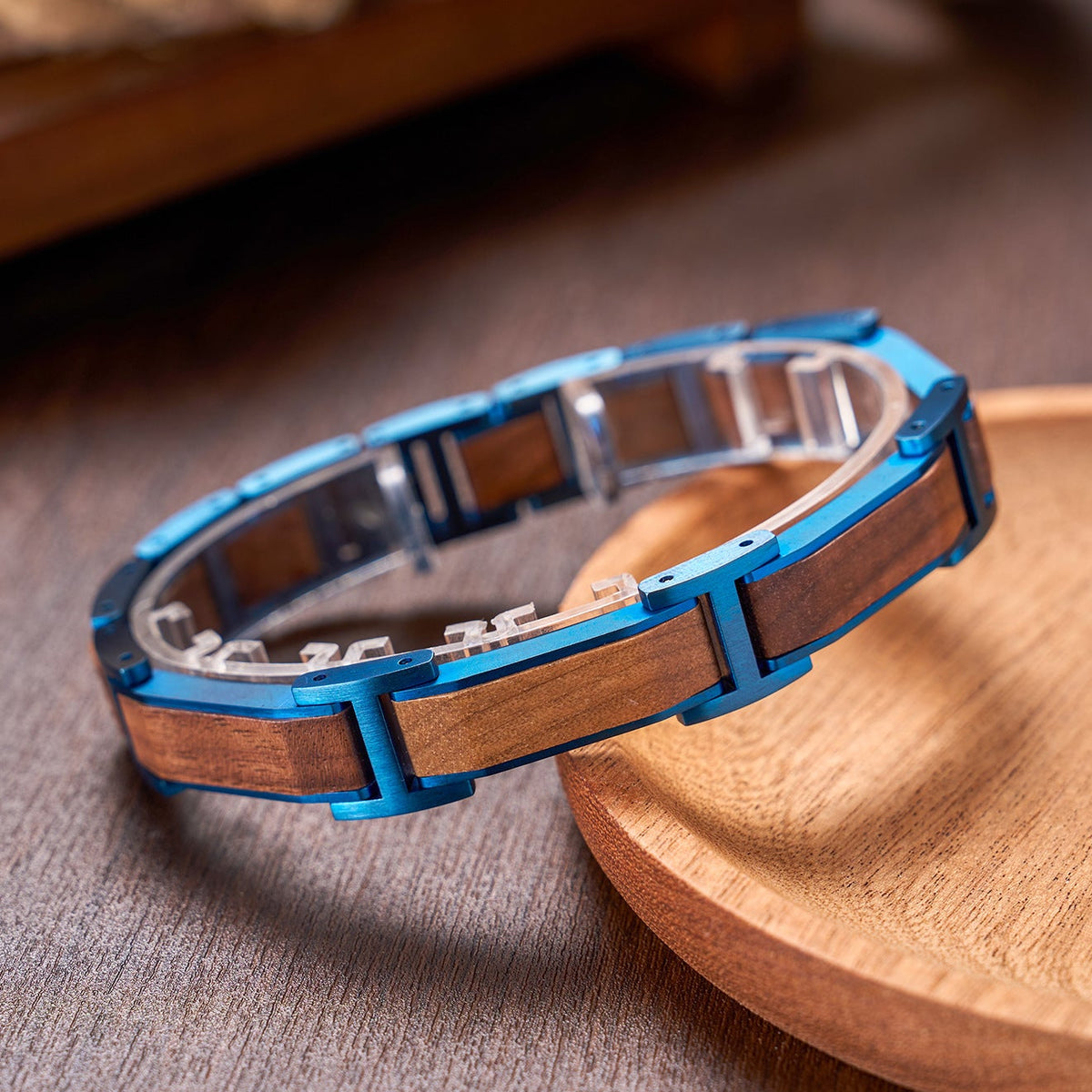 Men's bracelet crafted from blue stainless steel and walnut wood, a stylish accessory for men, featuring a unique combination of metal and wood design.