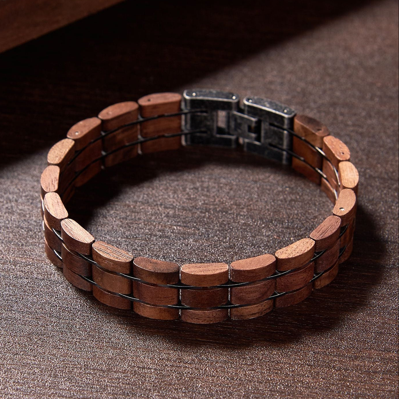 Men's wooden bracelet made of walnut wood and gunmetal stainless steel, stylish accessory for men, perfect for casual or trendy looks.