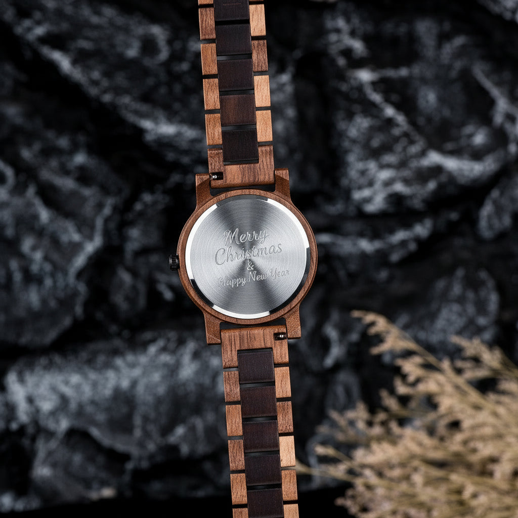 A rugged men's wooden watch featuring a two-tone dark and light wood band, presented from the back against a dark rock background with textured details to highlight its natural and masculine craftsmanship.