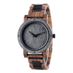 A rugged men's watch featuring a gray stone dial, wooden and black accent band, and industrial design elements, shown in detailed side view against a white background to highlight its masculine and natural aesthetic.