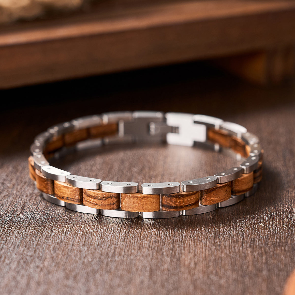 Men's stylish bracelet crafted from zebra wood and silver stainless steel, perfect for trendy men seeking a unique wooden jewelry piece.