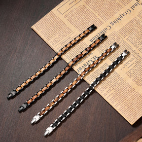 Assortment of men's bracelets made with zebra wood and stainless steel, offering stylish and unique wooden jewelry options for modern men.