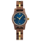A sophisticated women's wooden watch with a blue dial, gold accents, and Roman numerals, presented against a white background to highlight its refined and elegant design.