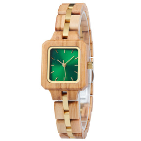 A refined women's wooden watch with a green dial and gold accents, shown in side view against a white background to highlight its craftsmanship and elegant design.