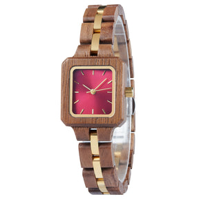 A refined women's wooden watch with a red dial and gold accents, shown in side view against a white background to highlight its craftsmanship and elegant design.