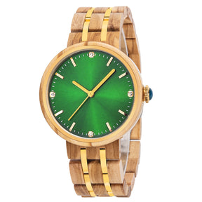 An elegant women's wooden watch featuring a green dial, gold-tone accents, diamond-like details, and a two-tone wood and metal band, shown in detailed side view against a white background to highlight its luxurious and sophisticated design.