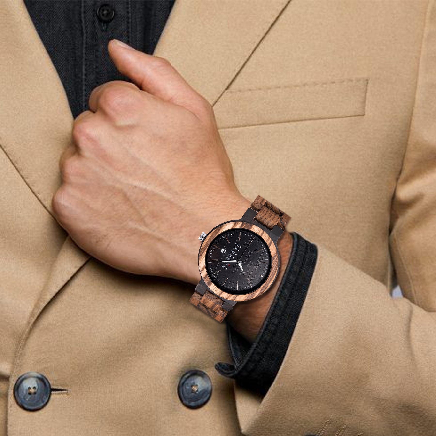 A man wearing a ebony and zebrawood strap wooden watch with black face
