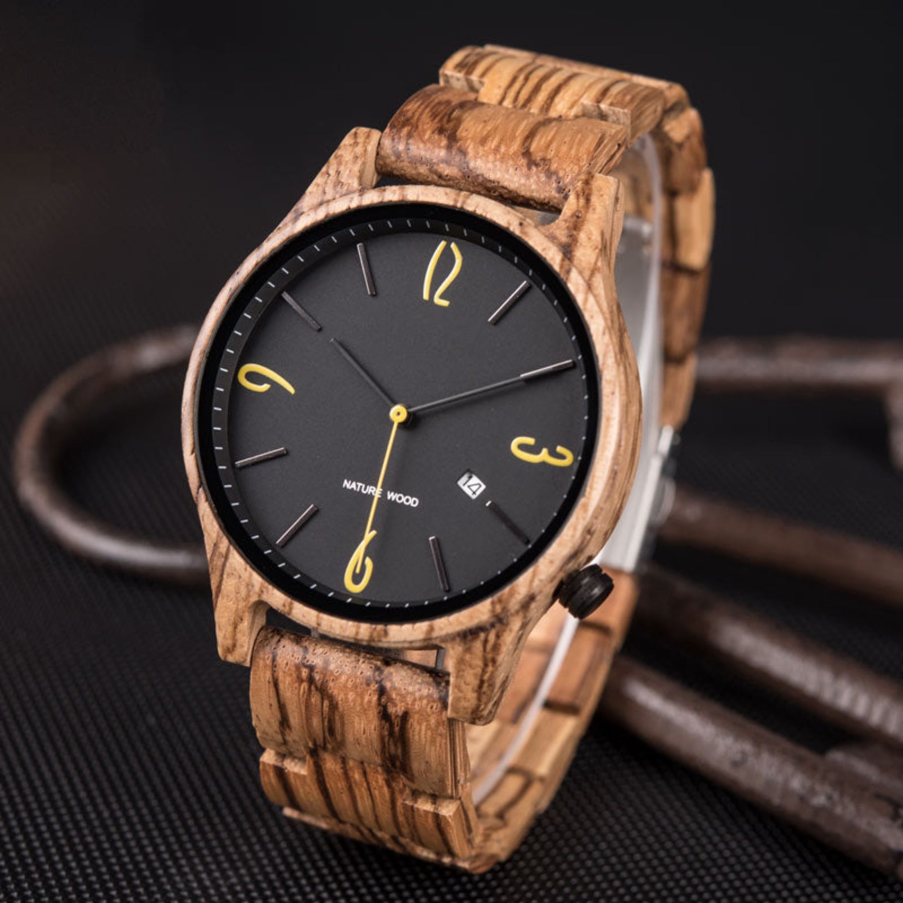 The zebrawood men watch with black face standing on black table